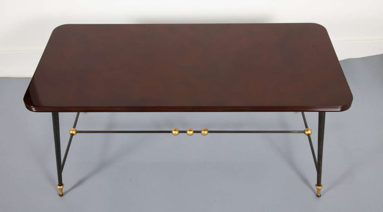 Brown dark red rectangular coffee table by Jules et André Leleu, 1960, on bronze and steel feet.
Signed, numbered.
Réf : F.Siriex, Leleu Décorateurs ensembliers, Ed.M.Hayot, 2007, Similar with marble top page 327 (CFPA Neuilly 1962).