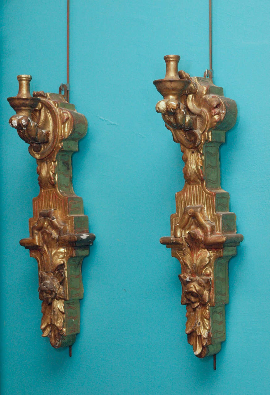 Pair of large scale 18th century carved and gilded wooden sconces with a single light