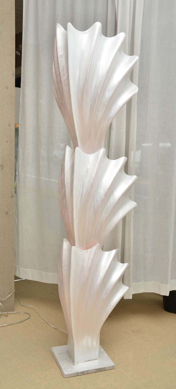 This is a rare and unusual Rougier corner floor lamp which is quite spectacular when lit with three acrylic shell shaped pieces on an acrylic base