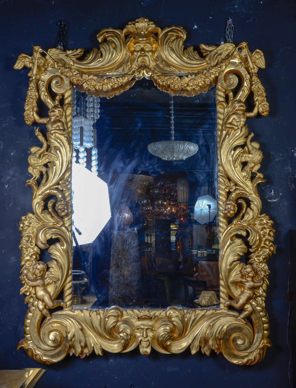 Huge Italian mirror in a beautifully carved wood frame, original mercury mirror and gilt.