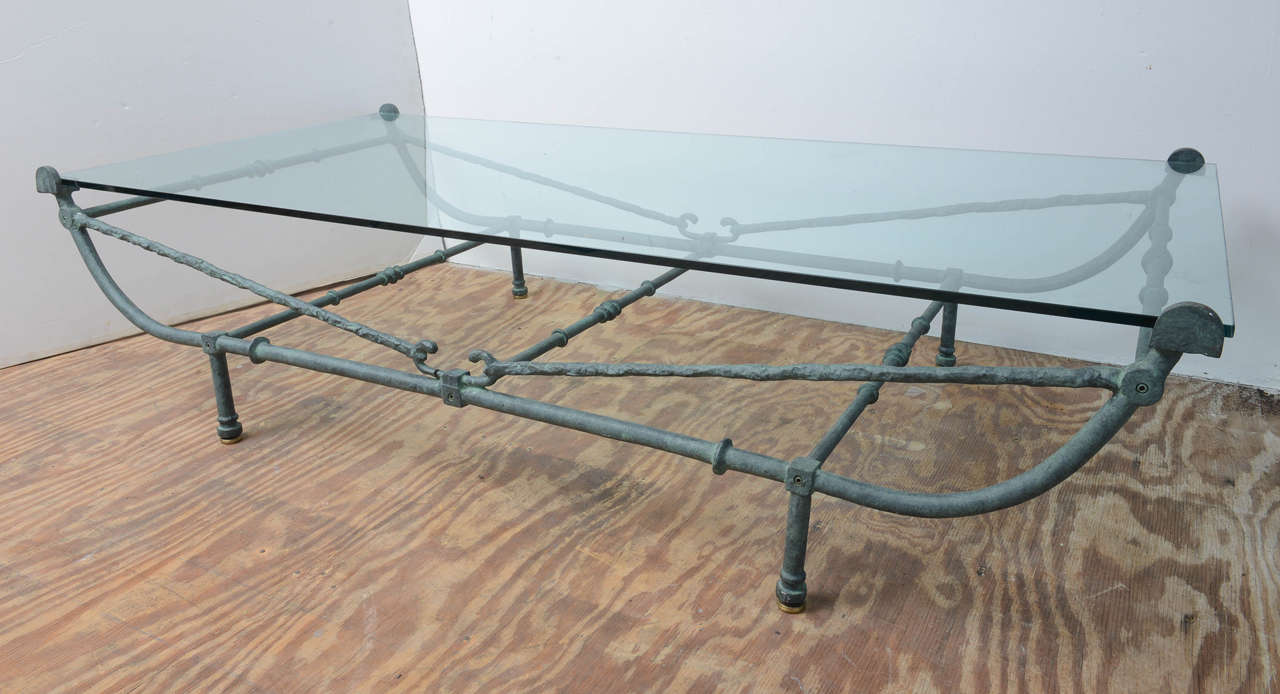 Stunning, large Giacometti style iron coffee table finished in a bronze green patina.