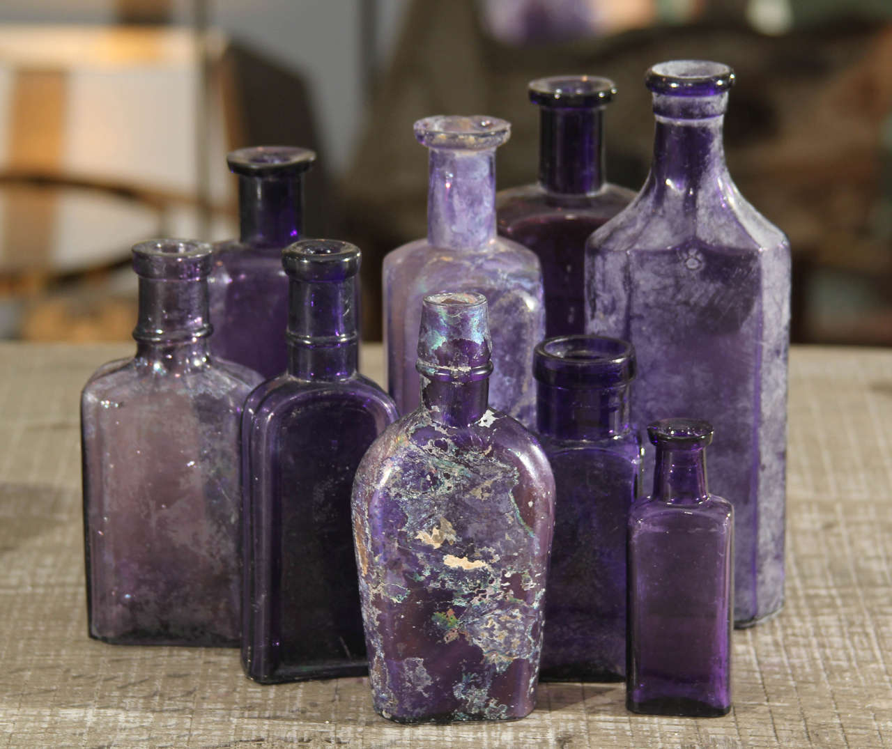 Nice assortment of nine antique purple bottles.