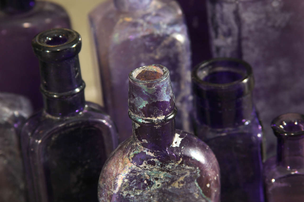 Set of Nine Purple Bottles In Distressed Condition In Seattle, WA