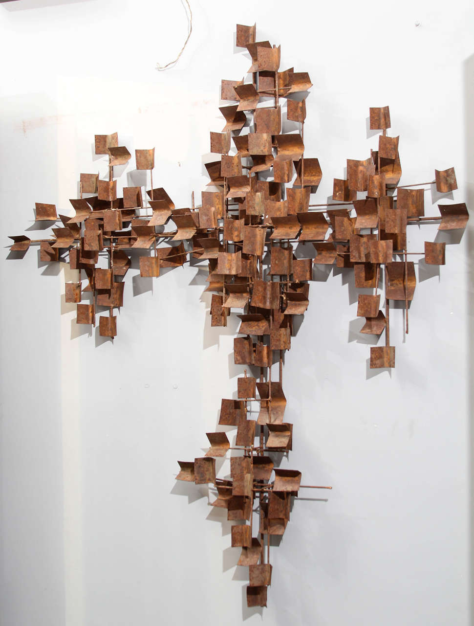 Large abstract wall sculpture with rusted patina.