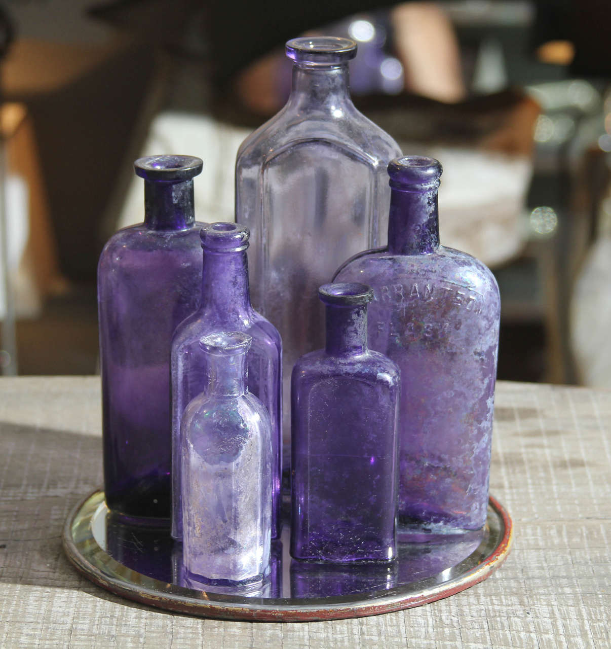 Nice assortment of antique purple bottles.
(display mirrors available - ask dealer).