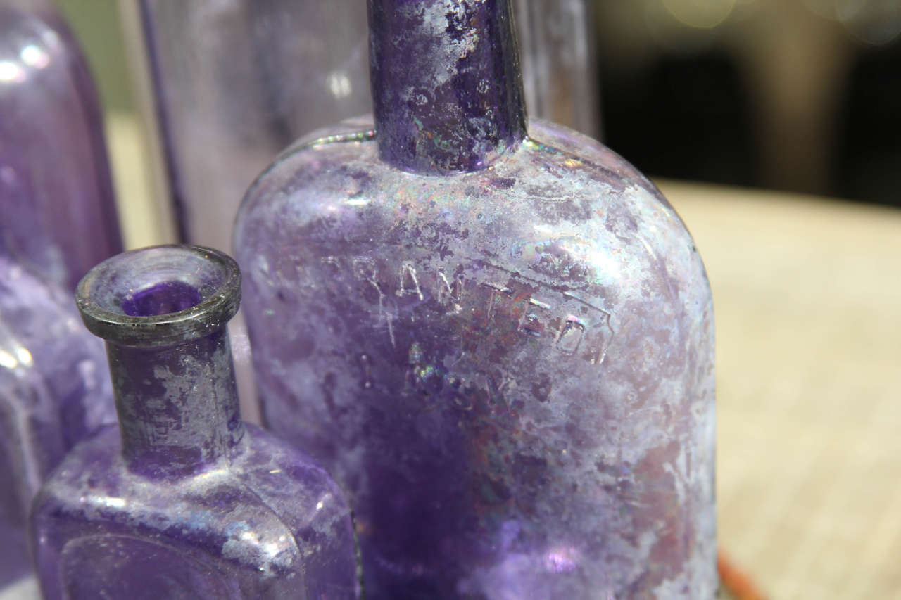 Group of Six Purple Bottles In Distressed Condition In Seattle, WA