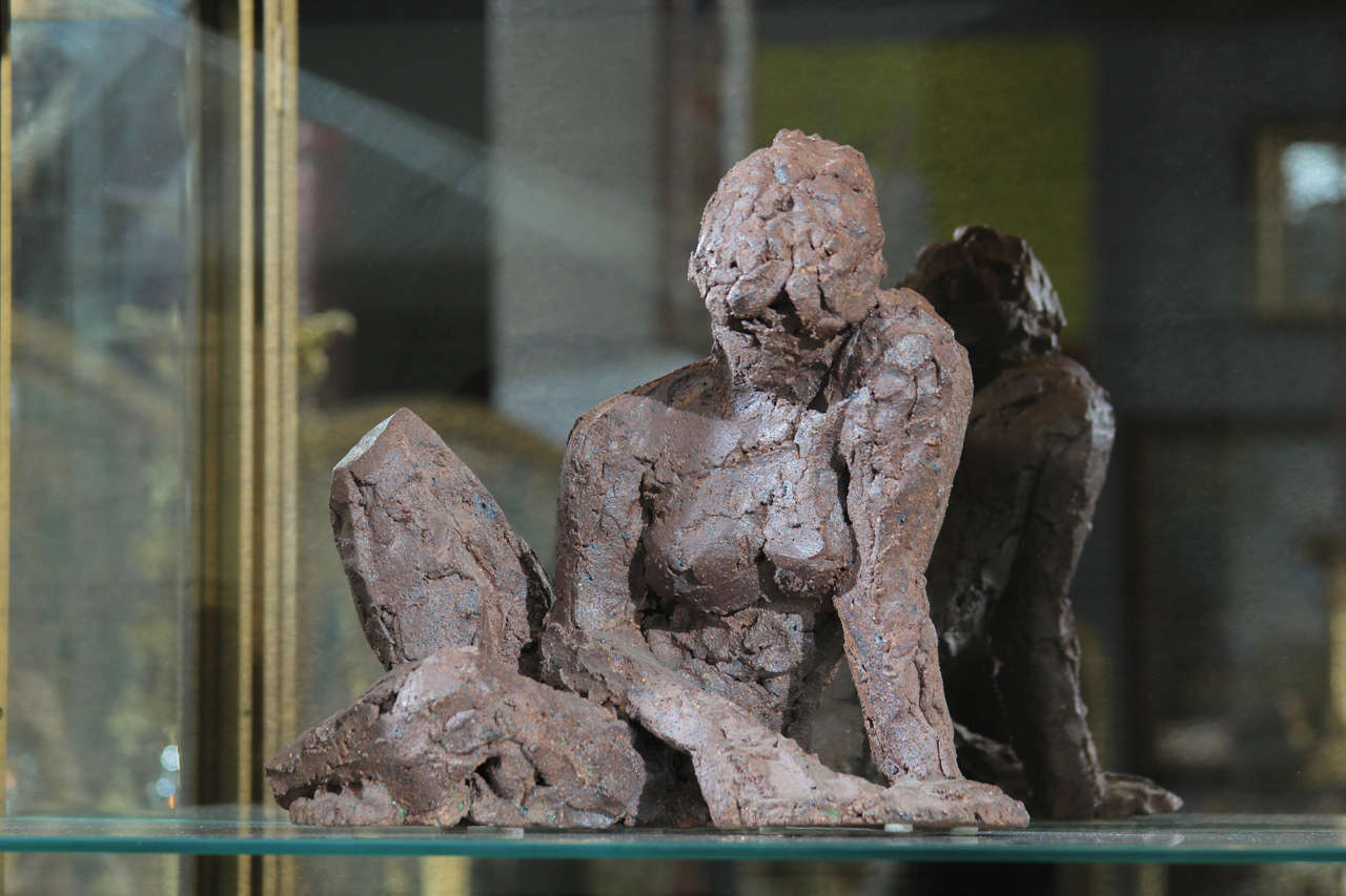 Female nude sculpture formed in clay.