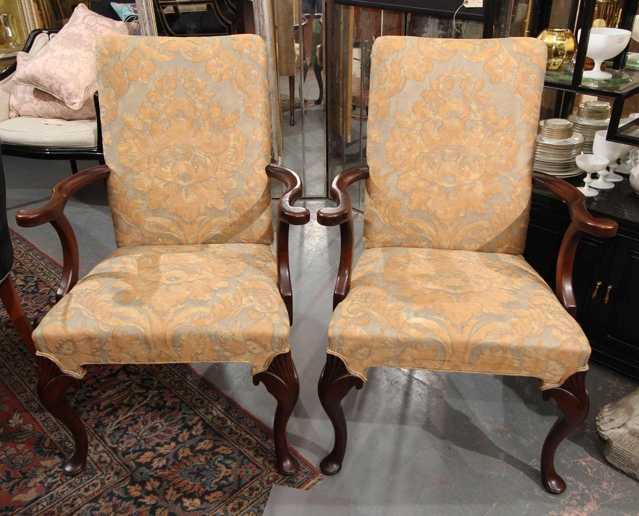Curvy pair of side chairs upholstered in vintage fortuny fabric.