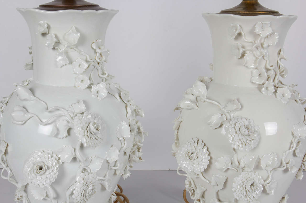 Chinese Pair of Antique Blanc de Chine Porcelain Lamps with Raised Flowers