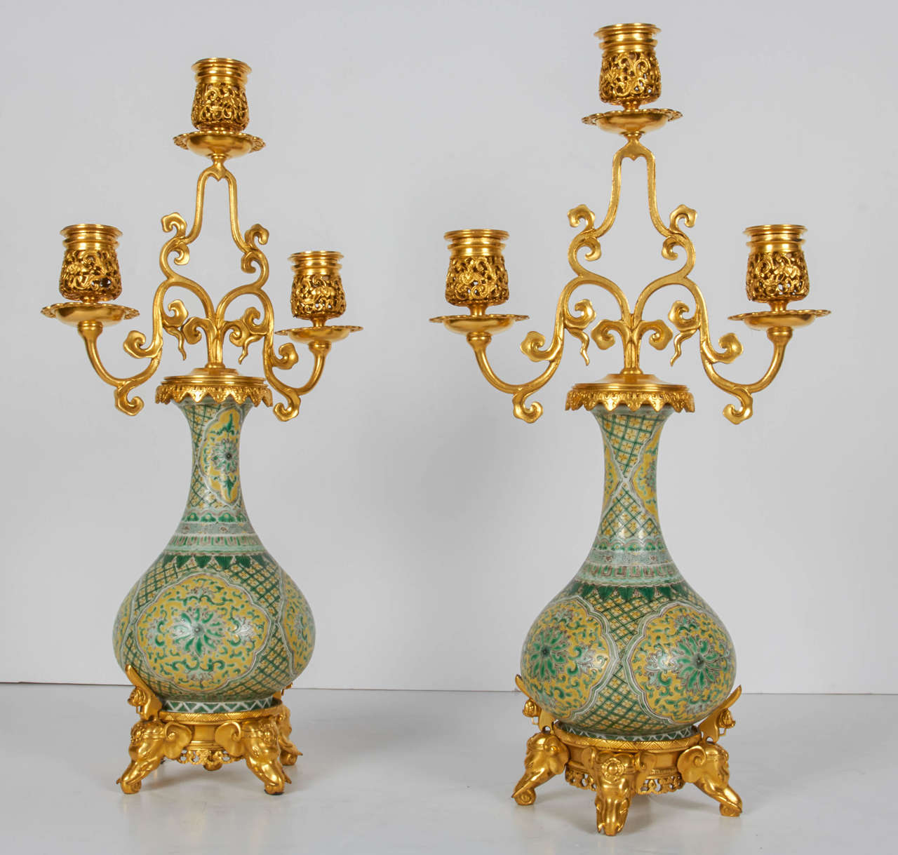 A very unusual pair of antique French doré bronze and Chinese Export porcelain, orientalist style, three-light candelabra designed by the outmost renowned French orientalist designer; Edouard Lievre, and finely executed by Ferdinand