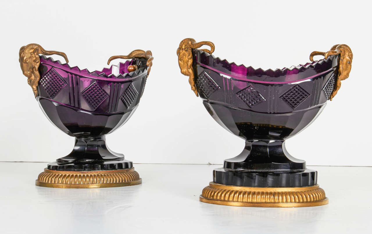 A fine pair of antique Russian ormolu and amethyst cut-glass compotes, 19th century. This pair of navette-shaped bowls cut with lozenge pattern and flanked by ram's masks on a gadrooned plinth. They were must probably made by the Russian Imperial