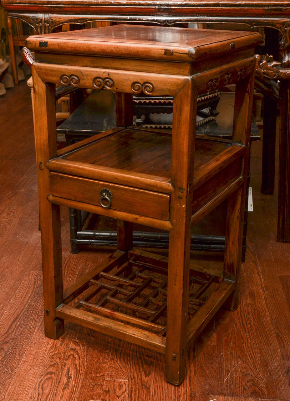 Late 19th century Qing dynasty southern Chinese elm three tiered vase or plant stand.