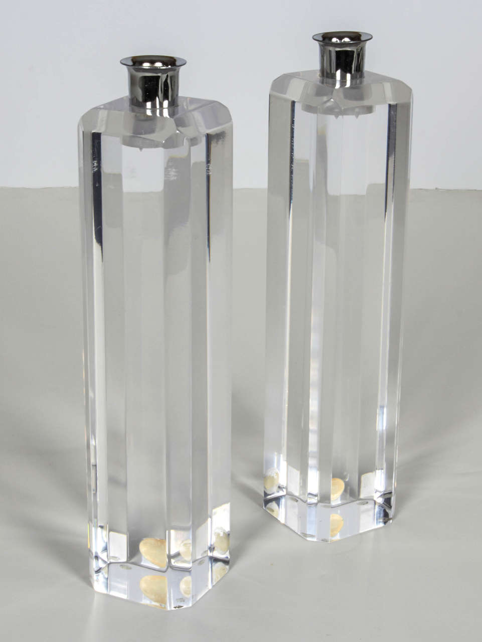 Pair of chic and sparkly, bevelled lucite candle stick holders with chrome trim. The holders have the original Ritts 