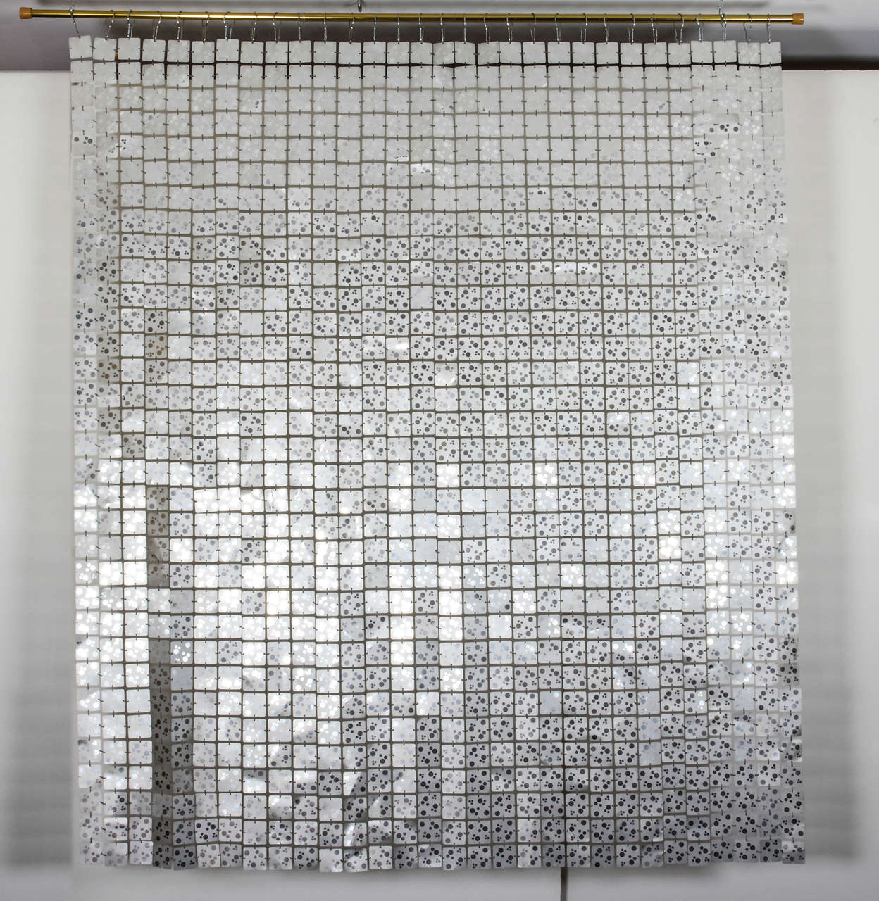 Gorgeous silver colored space curtain by Paco Rabanne. The curtain is comprised of the same links that he used on his iconic mini dresses: Plasticized metal squares joined by plastic silver colored clips. A versatile accent piece, it can be a wall