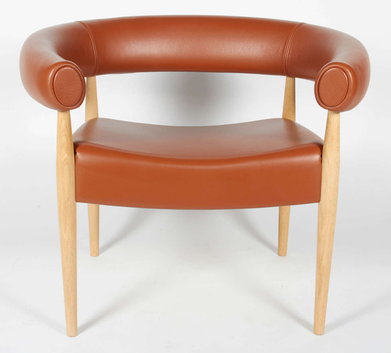 A wonderful and exceptionally comfortable pair of lounge chairs by Nanna Ditzel. The original design is from 1958, Denmark. This pair has been reupholstered in the not so distant past. The upholstery is a beautiful Italian ochre leather.
