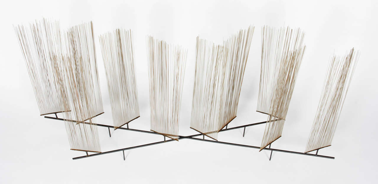 A very early sculpture that represents one of the many stages of Bertoia's experimentation with materials. He felt that 