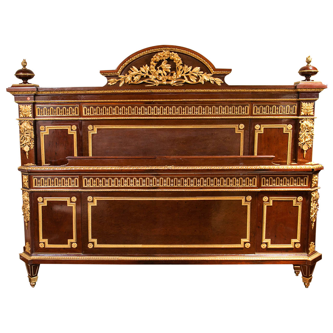 An almost impossible to find piece, this king-size bed is dripping with very Fine and robust bronze ormolu. It is all mahogany, and it even has it