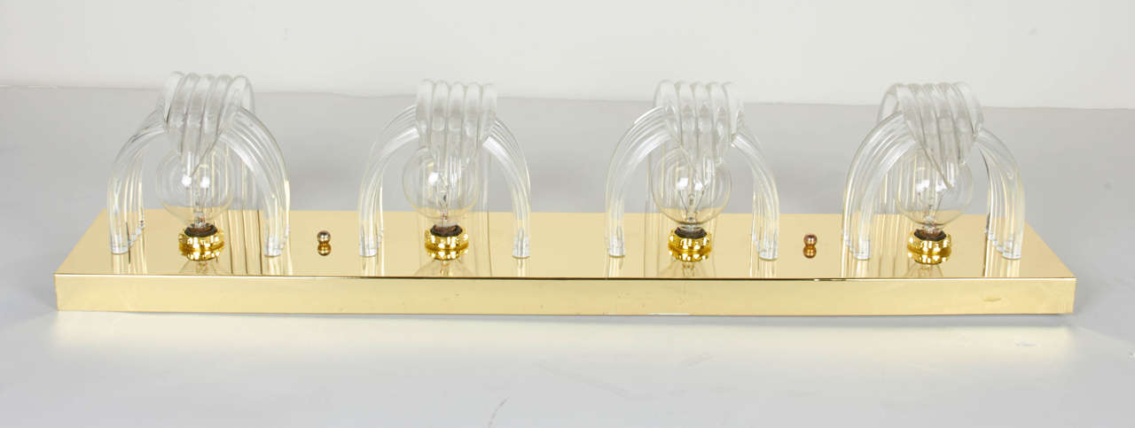 Molded Mid-Century Modern Sculptural Lucite and Brass Wall Sconce by Lightolier