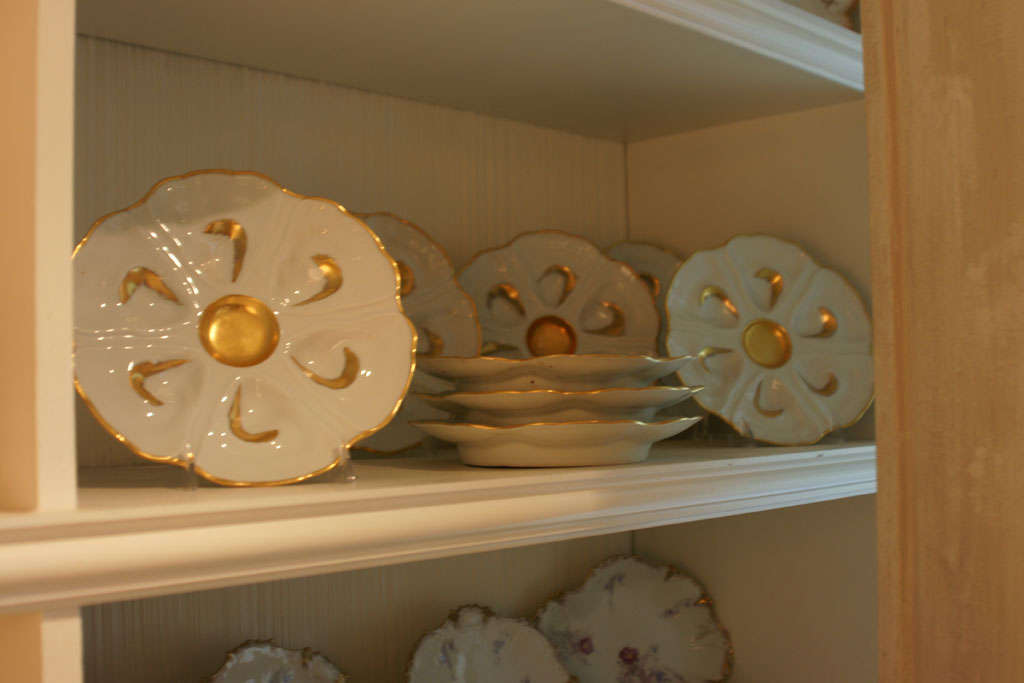 Set of 8 hand painted Limoges oyster plates with gold leaf accents