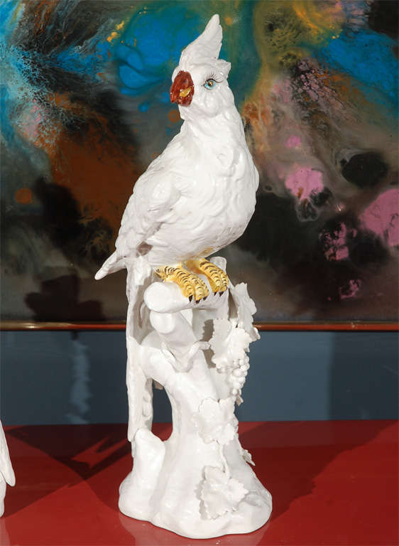 Pair of detailed, glazed ceramic cockatoos with hand painted accents.
