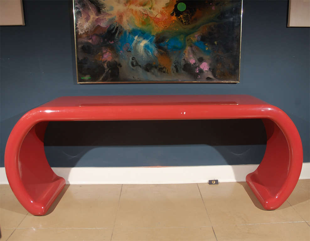 Modern burgundy lacquered waterfall style console table in the manner of Karl Springer.