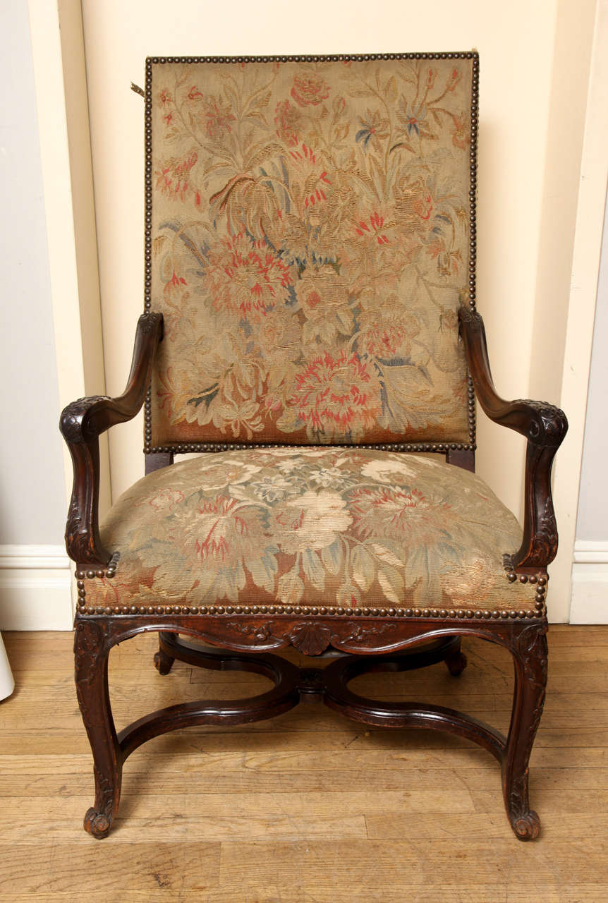 A Pair of French Louis XV-style Carved Walnut Open Armchairs