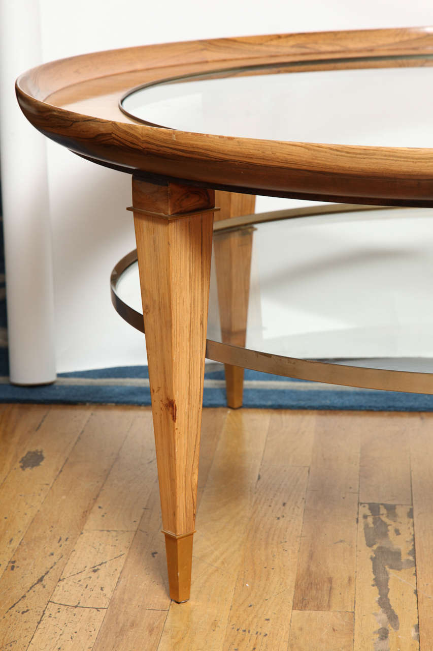 American A Round Two-Tiered Rosewood Coffee Table with Glass Top