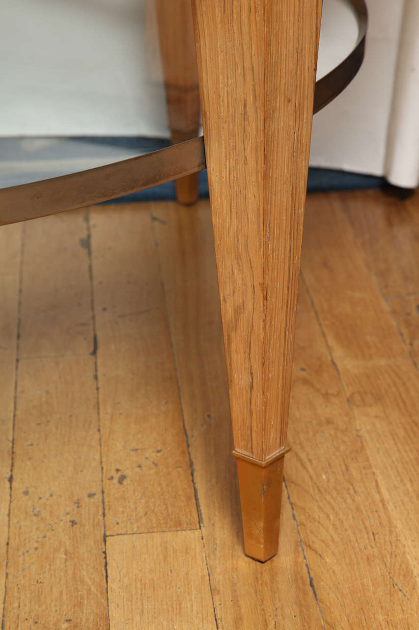 A Round Two-Tiered Rosewood Coffee Table with Glass Top In Excellent Condition In New York, NY