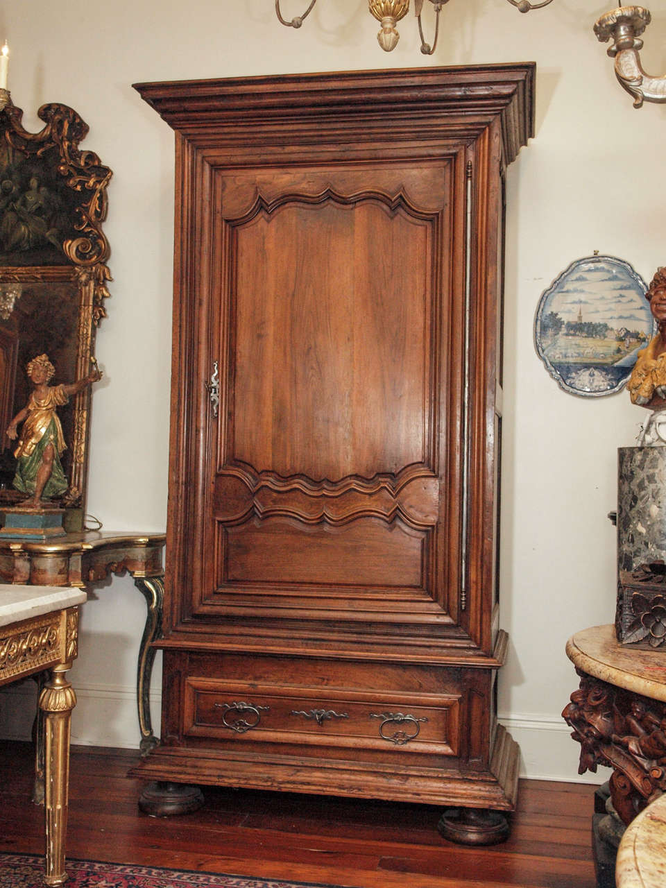 18th c. Palace Sized Walnut Bonnetiere with paneled door with large crown and bun feet 
steel hardware