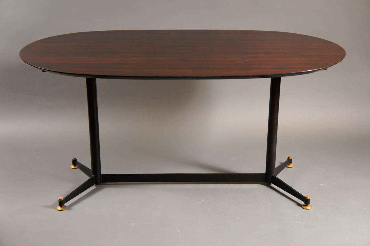 Italian oval rosewood table with metal base.