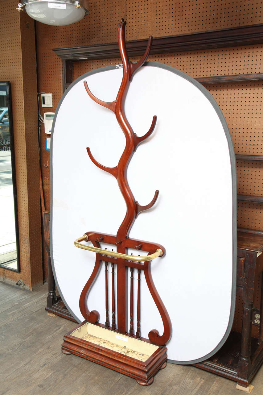 UK, circa 1860

Fine mahogany coat stand with lyre form base. Handpicked by the buyers at Ann-Morris, Inc.