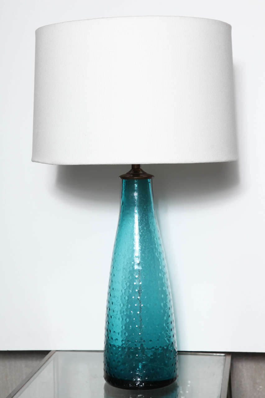 A hobnail design adds texture and depth to these rich turquoise glass lamps. Base is 16
