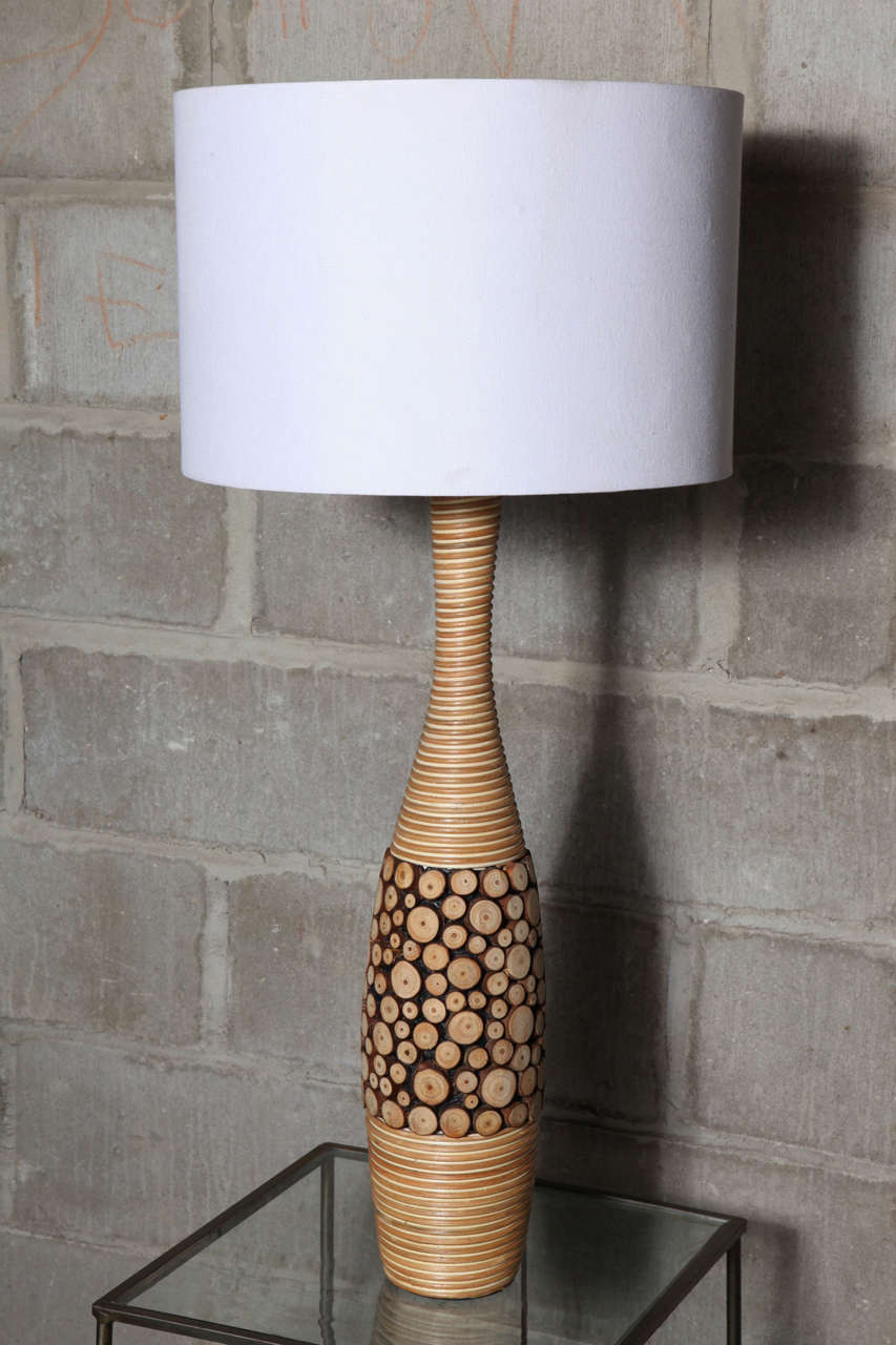 Organic lamps in rattan and carved pine over ceramic. Contrast in textures and materials; unity in design. Base height is 26