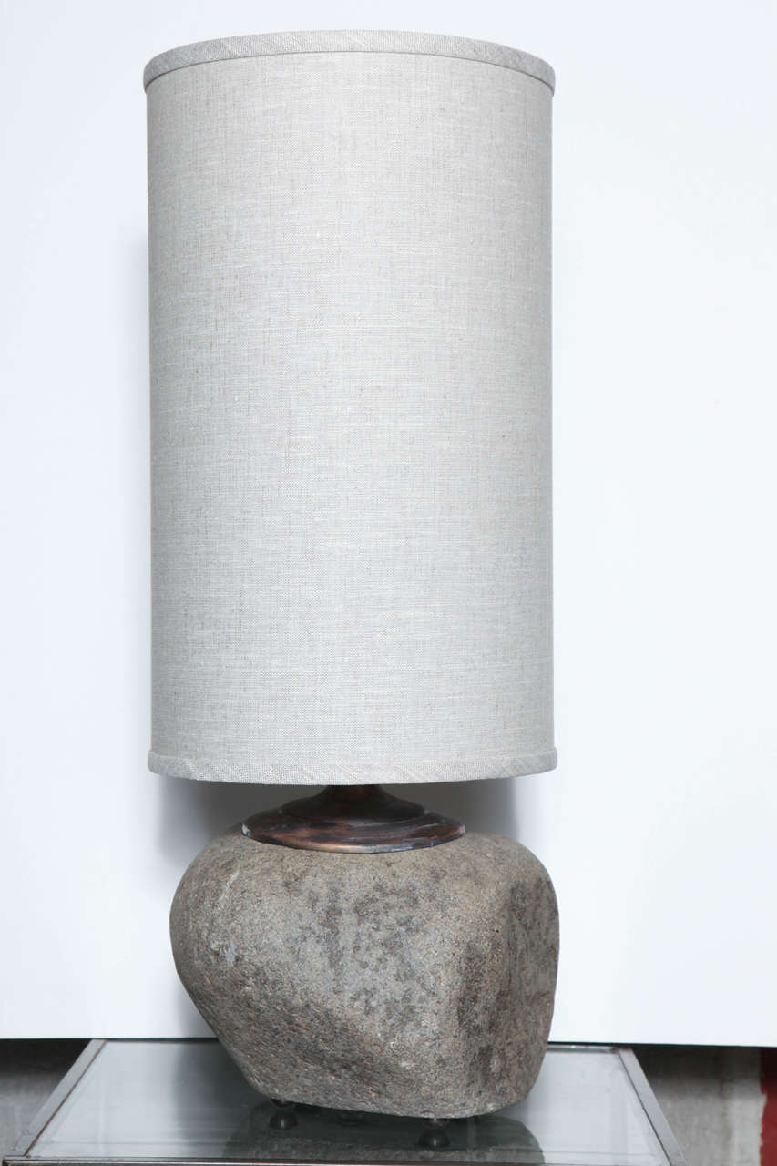 Abstract design in unpolished granite creates a handsome, textured shape. Because of natural material each lamp has its own variations in shape as shown in photographs. Bases are 9