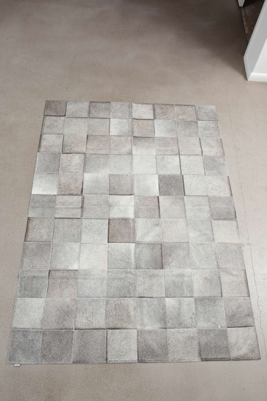 This Pure Exotic Zebu patchwork cowhide rug is sewn together by Brazilian craftsman. Pure's cowhides originate from the Pampas Grasslands of Brazil, all individually selected for their superior quality, shine and softness. Then each patchwork rug is