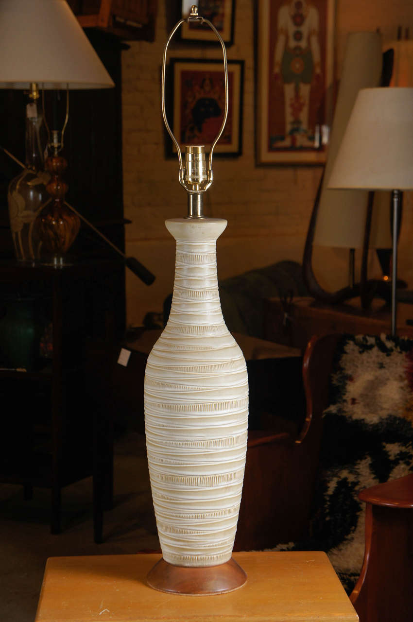 Subtle beige over cream stripes flow down this graceful well proportioned table lamp. Grand scale. Teak base.