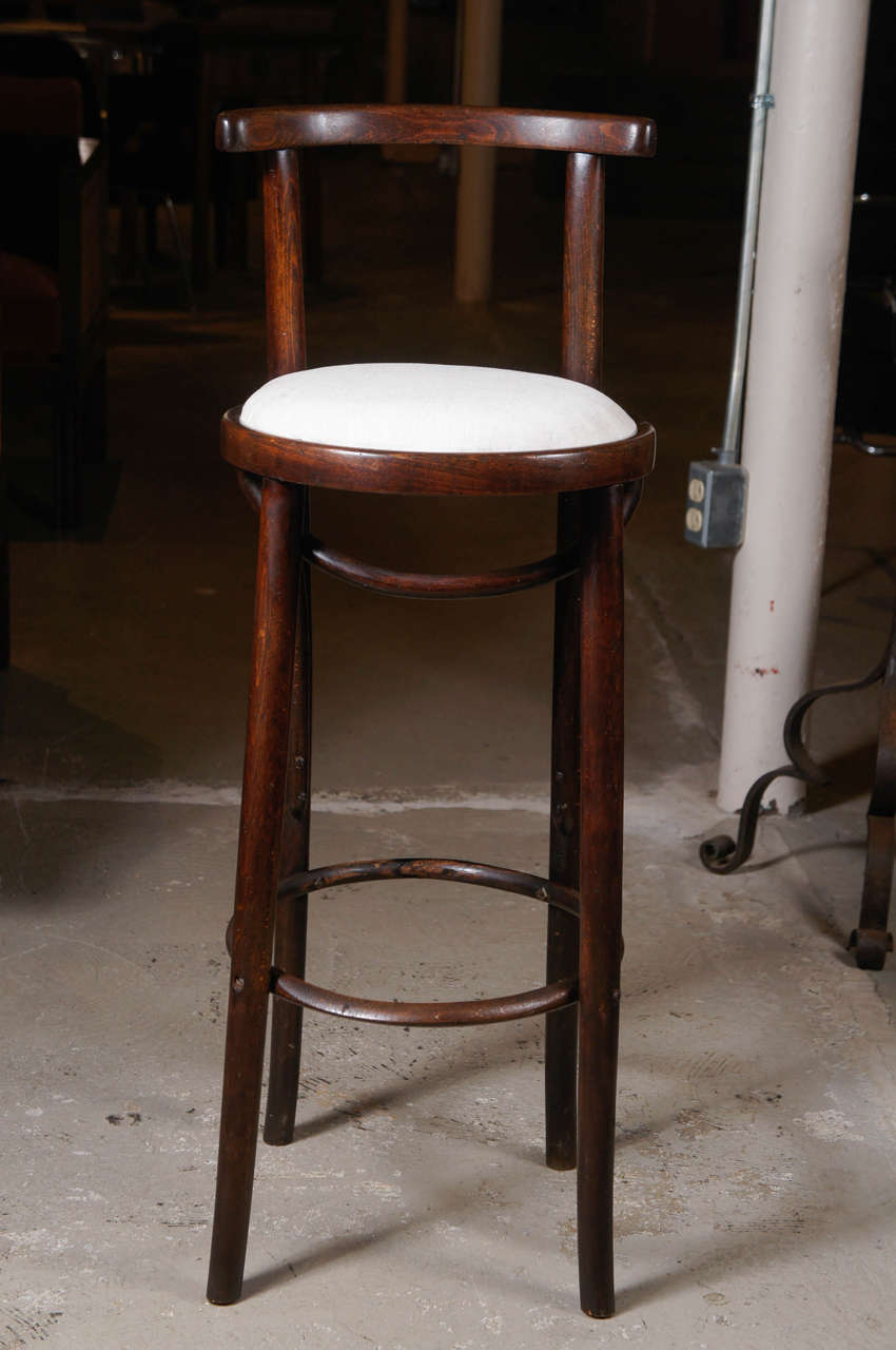 Bentwood Thonet stool with back and white cushioned seat. Very comfy for a small-scale stool. Lovely form.