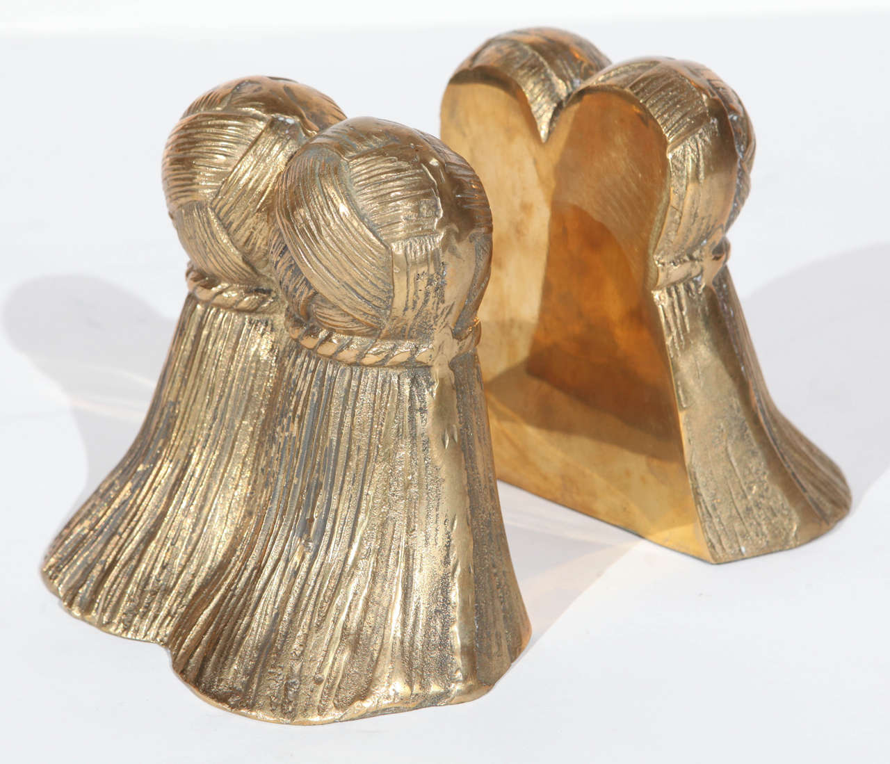 A wonderful pair of vintage solid brass tassel bookends. Each bookend measures 7