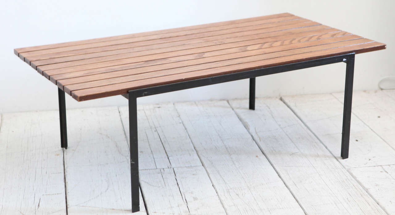 Slatted rosewood and steel coffee table. Two available. Sold individually.