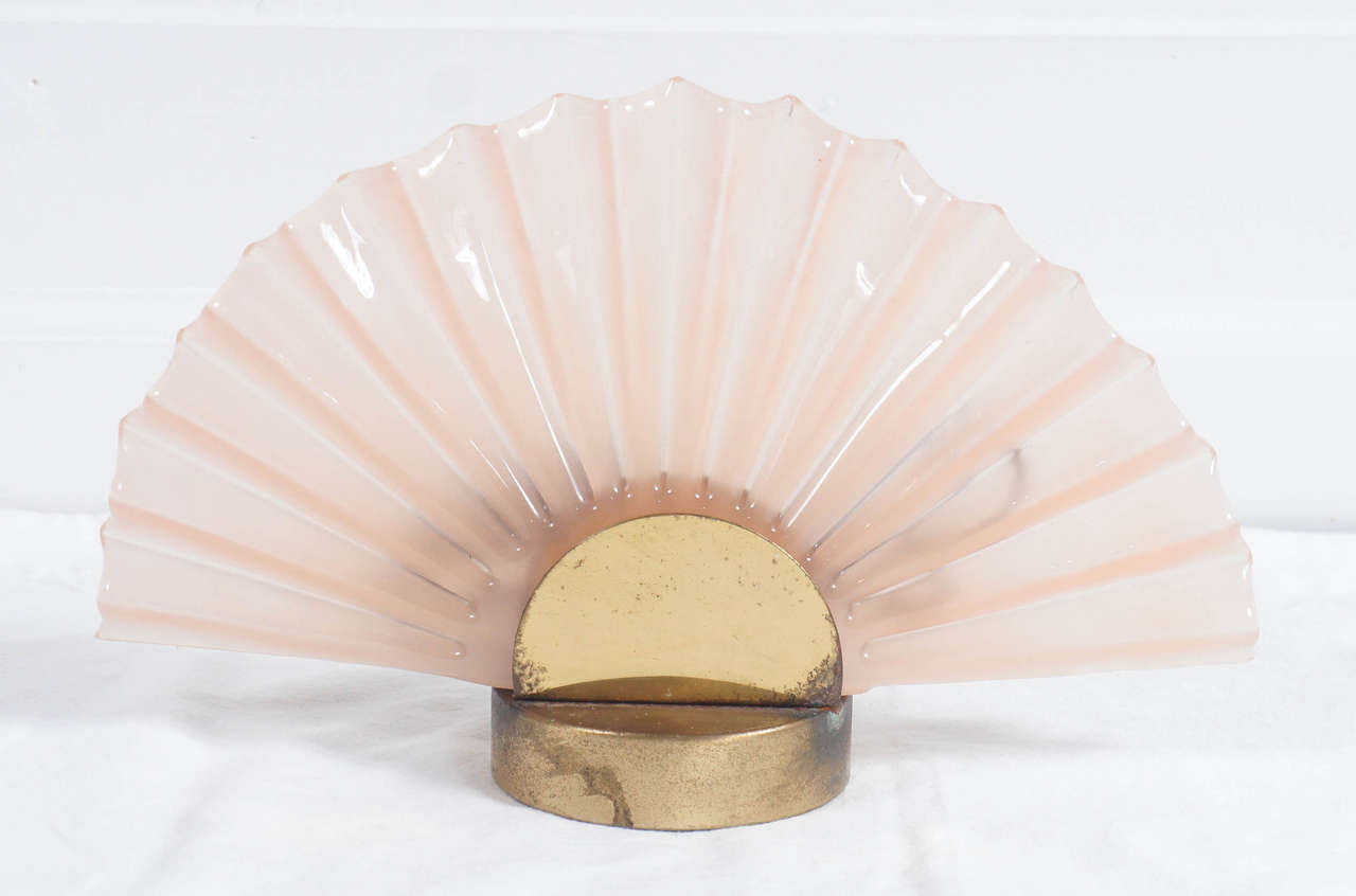 these lamps are so chic!
Pink Murano glass clam shells with aged brass plated stands.
They light beautifully for that elegant warm atmosphere. They are perfect for a bedroom.