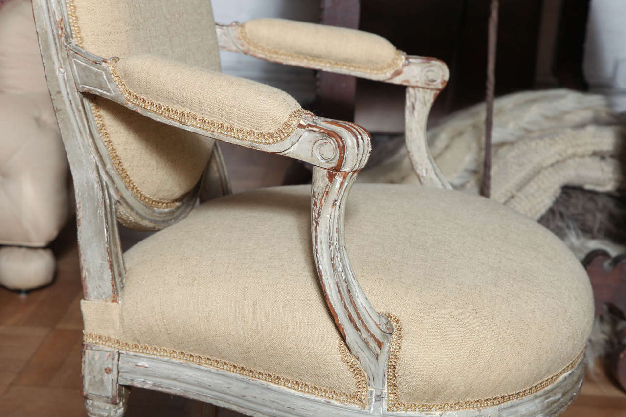 A Pair of Louis XVI Carved and Painted Beechwood Fauteuils A La Reine 1