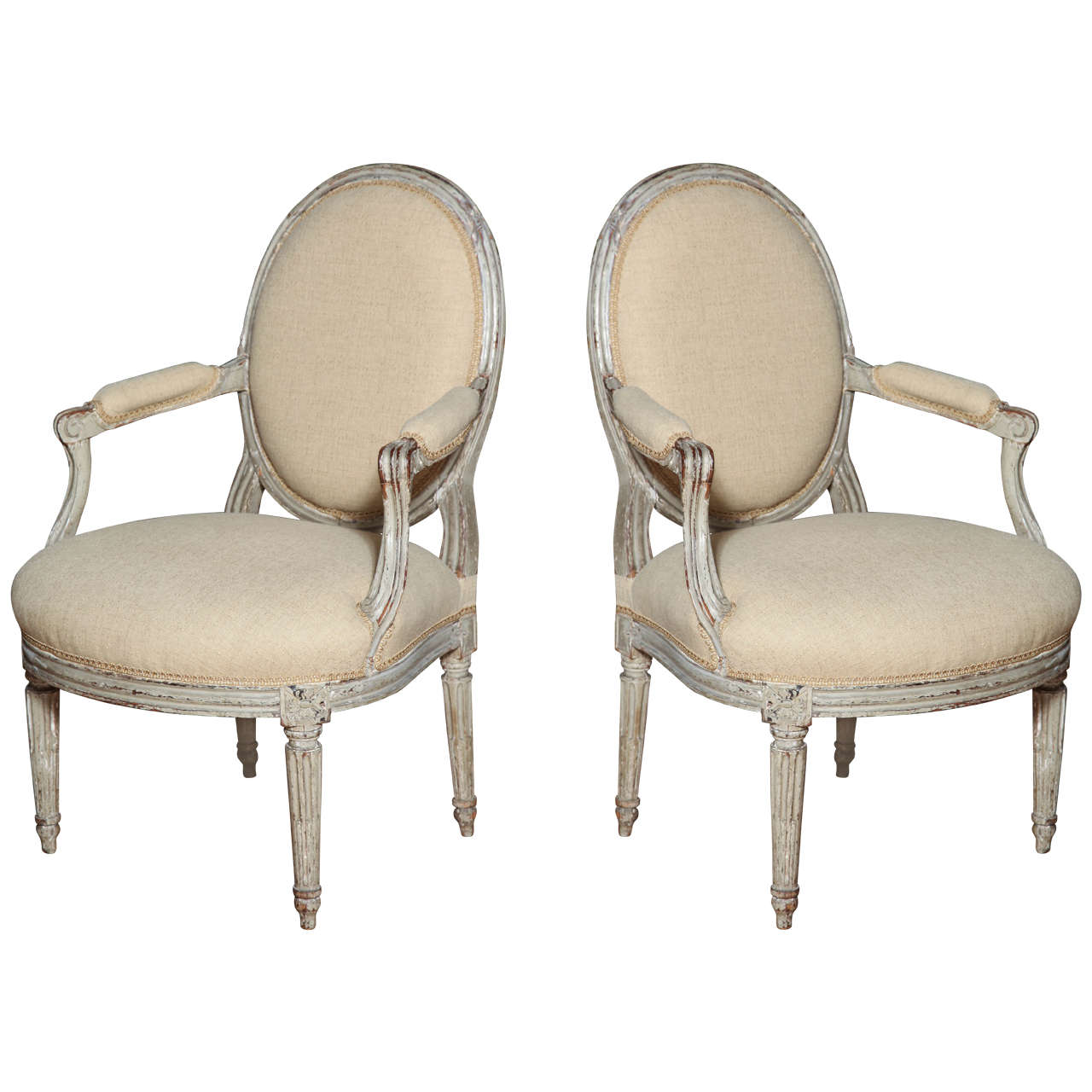 A Pair of Louis XVI Carved and Painted Beechwood Fauteuils A La Reine