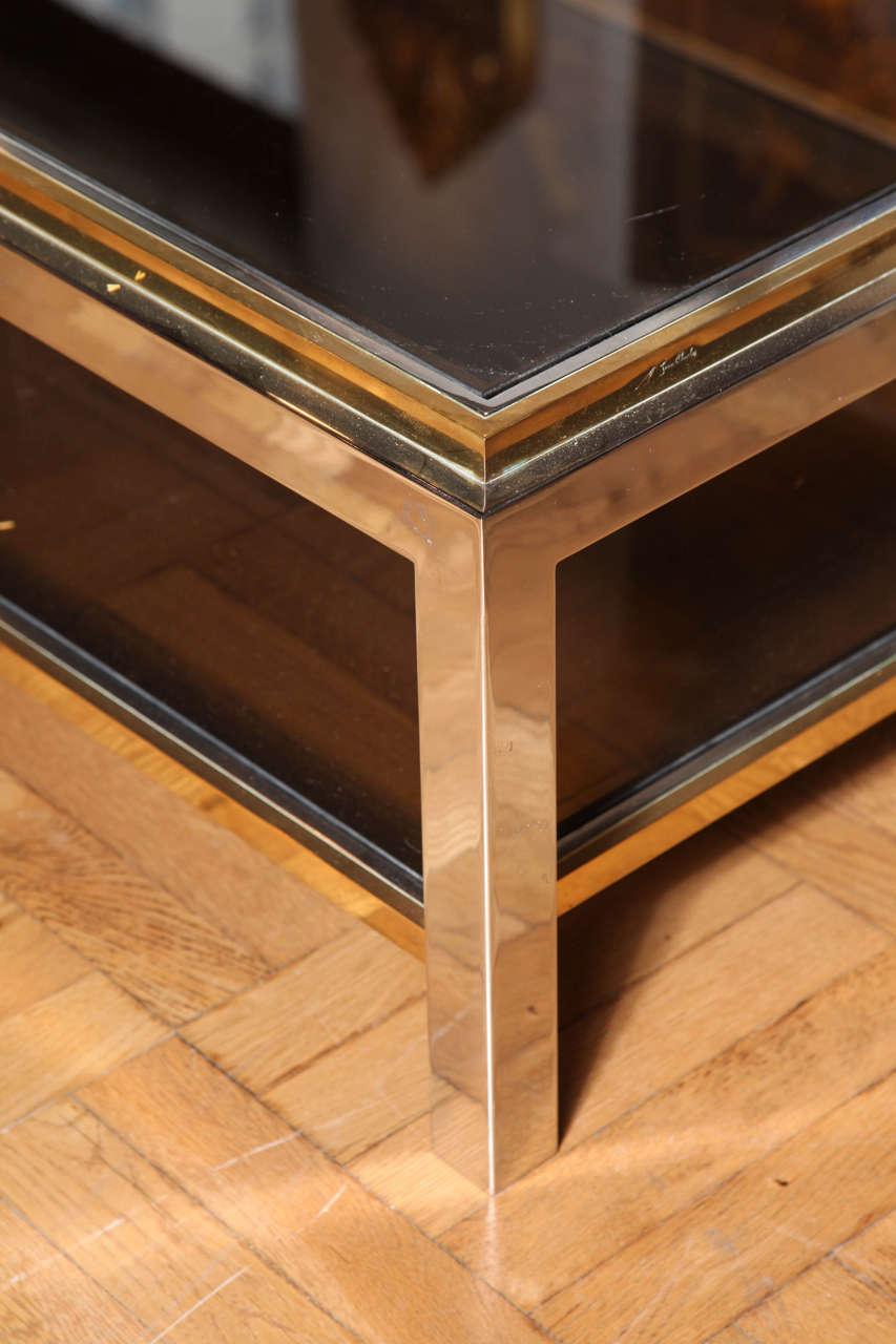 A Maison Charles Stamped Brass, Chrome and Glass Coffee Table. France c. 1970 In Excellent Condition In New York, NY