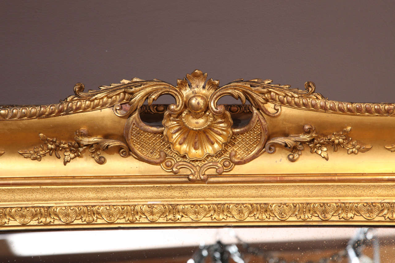 A Louis XV Style Carved and Gilded Mirror. France 19th Century In Good Condition In New York, NY