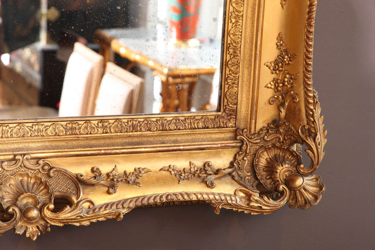 Giltwood A Louis XV Style Carved and Gilded Mirror. France 19th Century
