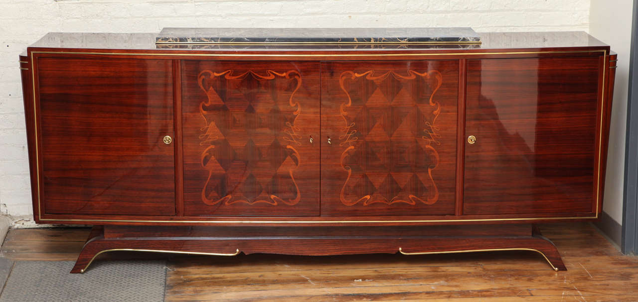 Elegant Art Deco sideboard with two internal drawers. Original bronze details. Marble top. Palissandre with marquetry doors. Portoro marble top.