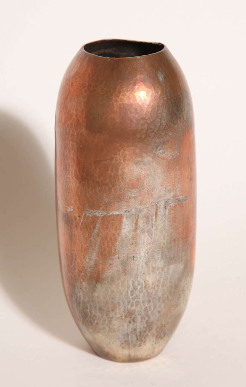 Cylindrical copper dinanderie vase with martele surface.
Impressed underneath J. PEREY/ PRIMAVERA/ FRANCE.

(Price shown is reduced price, no further trade discount) 