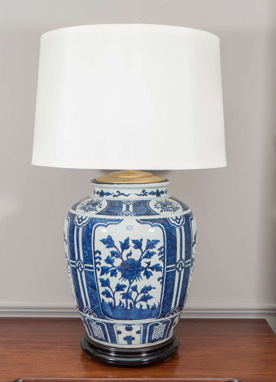 Pair of Chinese Blue and White Porcelain Jars, Wired as Lamps. On wooden bases. Shades available separately.

28