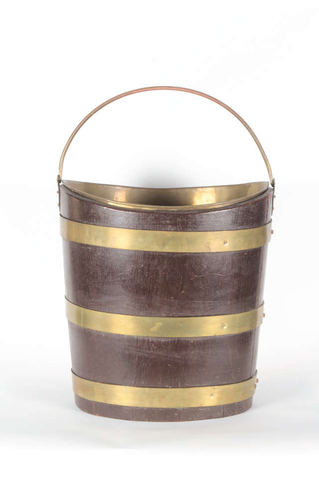 A nice quality brass bound mahogany pail with removable liner.
Originally used as a peat or coal bucket.
English circa 1840