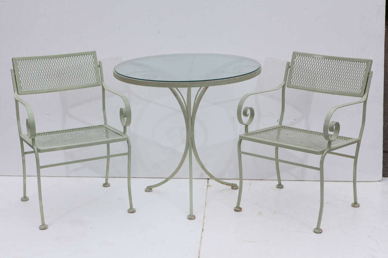 Vintage 40's outdoor/patio set, table and two chairs.  Glass top for the table.  The backs of the chairs swivel for extra comfort.  Possible attributed to Salterini.
Great condition.
Table measures 29